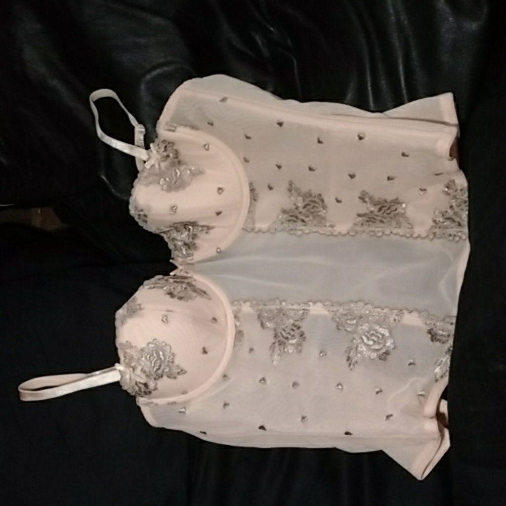 Corset with embroidery and lace.